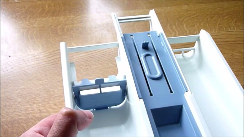 Clean the Detergent Drawer and Dispenser Tray